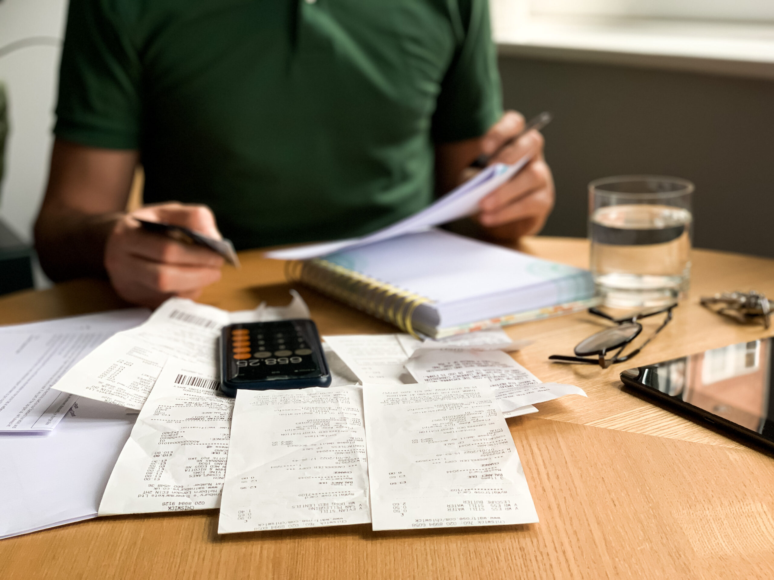 man-is-making-audit-of-household-expenses-using-ca-2024-12-07-19-25-57-utc